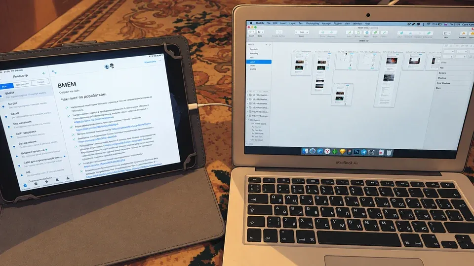 A MacBook with Sketch layouts and an iPad with a revision checklist from the freelance years.